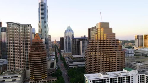 Aerial view approaching the Congress avenue in downtown Austin, sunny, summer evening in Texas, USA