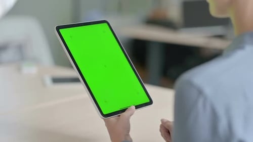 Woman Using Tablet with Green Screen