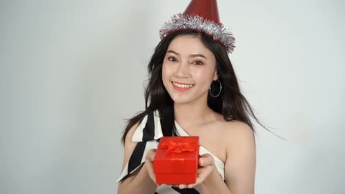 Smiling Woman Holds Birthday Gift