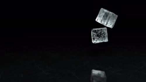 Two Falling Ice Cubes on a Textural Surface in Slow Motion