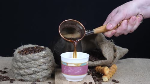 Coffee Pour Still Life With Beans and Pastries