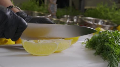 Woman Cuts Lemon Into Half on the Wooden Cutting Board. Close Up View. Healthy Ingredient for