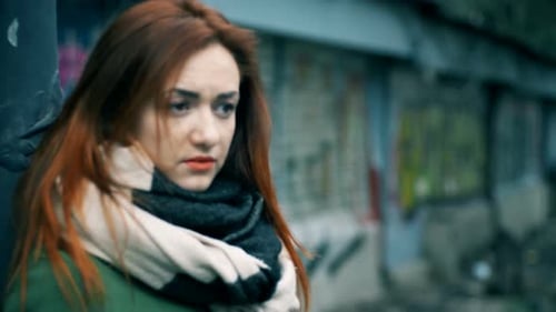 Young Woman Alone and Sad in The Street