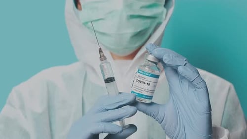 Doctor Preparing for Human Clinical Injection Trials Vaccination Covid19