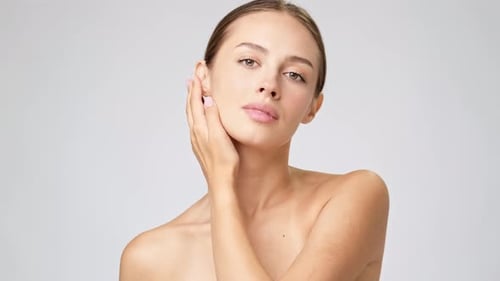 Young Woman Posing With Hand on Face