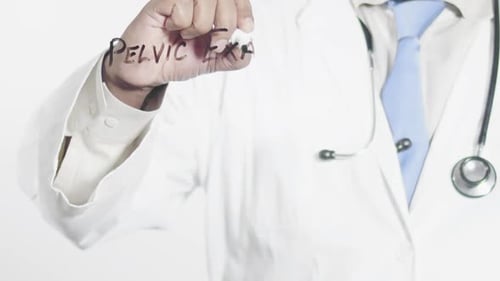 Doctor Writing Pelvic Exam on Clear Surface