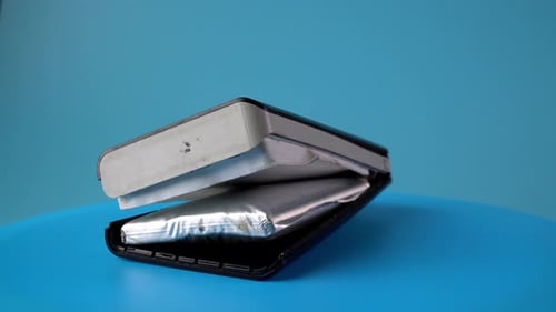 Damaged Cell Phone with Bulging Battery Close Up