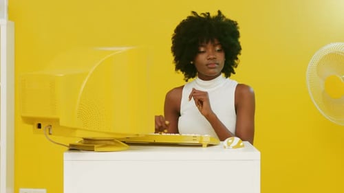 African Woman Is Sitting and Dancing In Creative Office