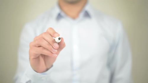 Man Writes Target on Transparent Surface