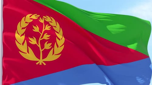 Eritrea Flag Waving in the Wind with Clear Blue Sky