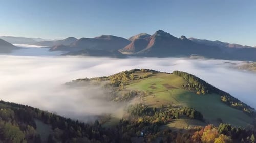 Aerial View of Rolling Hills with Morning Mist