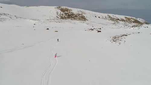 Skier and Snowboarder at a Ski Center