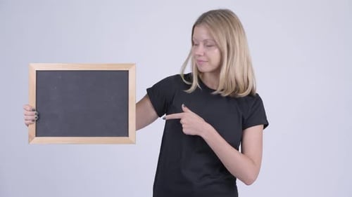 Blonde Woman Holding Blank Chalkboard and Giving Thumbs Up
