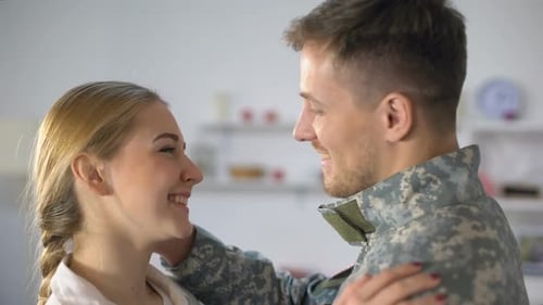 Happy Couple Embracing After Military Homecoming