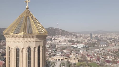 Aerial view of Holy Trinity Cathedral Sameba in Tbilisi Georgia. Sunrise drone footage 2021