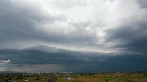 Ominous Storm Clouds over Rural Landscape
