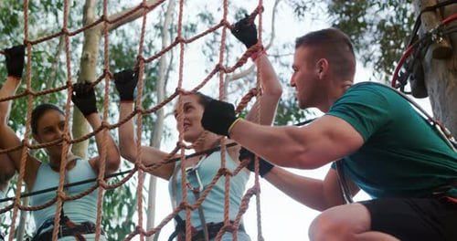 People Challenging Themselves on a Rope Obstacle Course