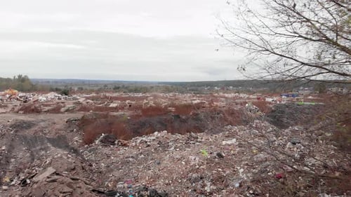 Field with big garbage construction dump. Construction waste. Ecological pollution.