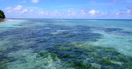 Tropical aerial tourism shot of a summer white paradise sand beach and aqua turquoise water background