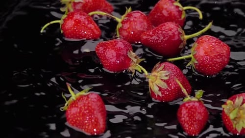 Ripe Strawberries Falls on the Table