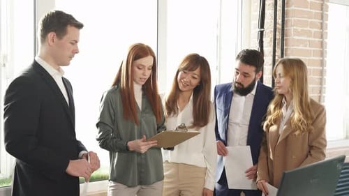Cheerful Group of Partners Having Good Work Time in Office