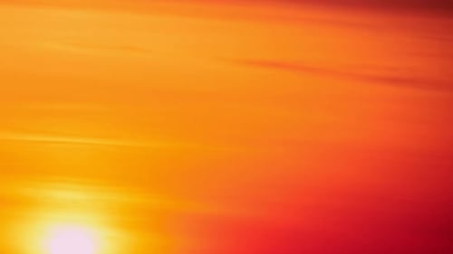 Morning sky at dawn with a large sun rising over the city, sunrise timelapse