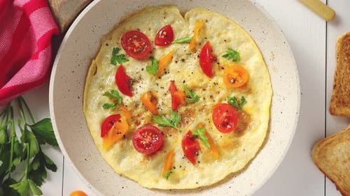Bright Omelet with Vegetables in Skillet Overhead