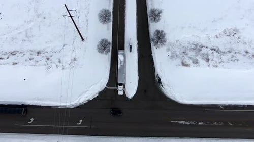 Aerial View of Trucks on Snowy Roads