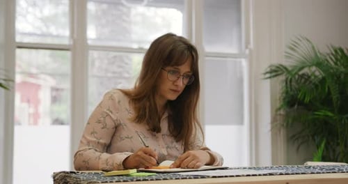 Millennial female professional working in a creative office