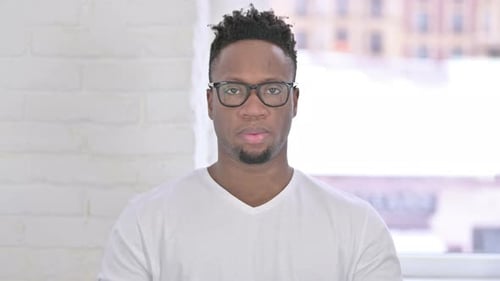 Young Adult Man Looking Directly into Camera