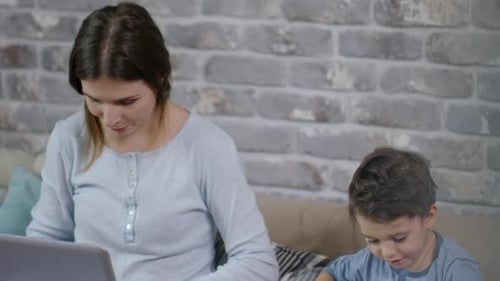 Mother and Child Enjoying Technology at Home
