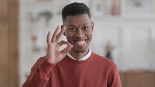 Man Gives Ok Sign in Close Up Shot