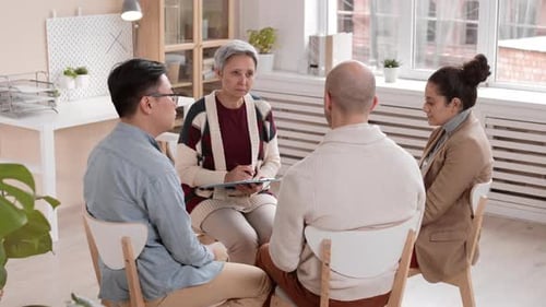 Group Therapy Session With Supportive Adults