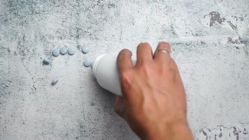 Blue Pills on concrete background