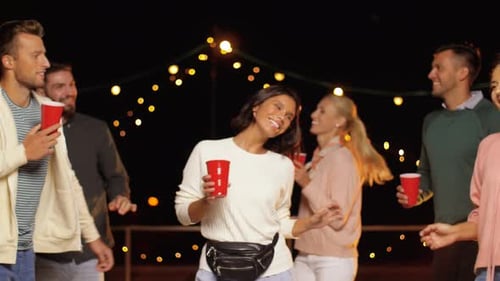 Friends Celebrate Together at a Nighttime Party