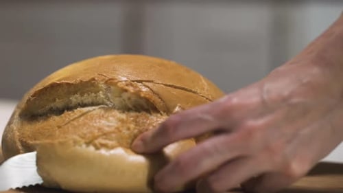 Loaf of Bread being Sliced