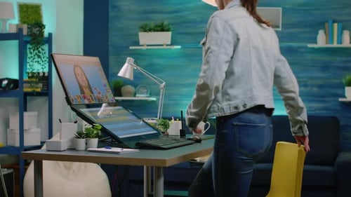 Woman Working at Computer Workstation with Touchscreen