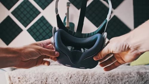 POV of Putting on VR Glasses Virtual Reality in the Living Room