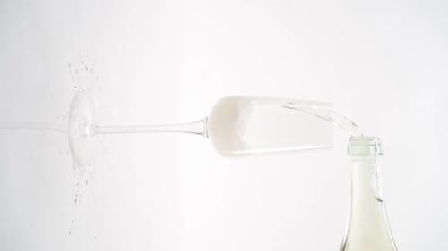 Vertical video, Close-up of sparkling champagne being poured into a glass; bubbles in a glass