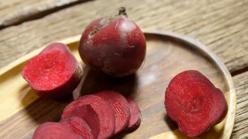 Sliced beetroot arranged on wooden tray 4k