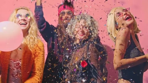 Friends Celebrate With Balloons and Confetti at Party