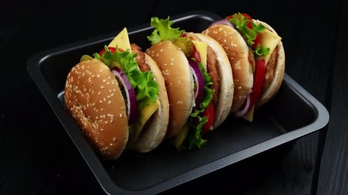 Appetizing Burgers Displayed in a Black Tray
