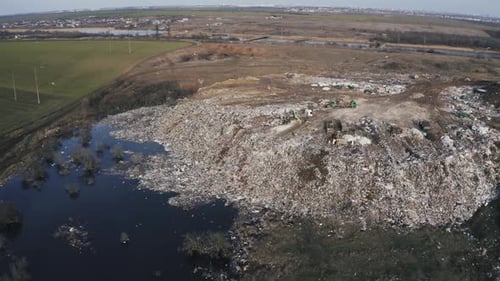 Aerial View on City Garbage Dump with Flocks of Birds