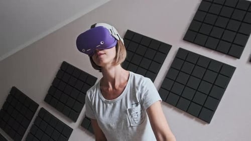 Woman using Virtual Reality Headset in Room