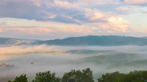 Time lapse of the morning fog and clouds in Tuscany Italy