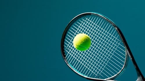 Dynamic Tennis Racket Hitting Ball in Slow Motion