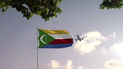 Comoros Flag Waving with Airplane Flying Over Modern City