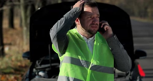 Man Calls for Help with Broken Down Car