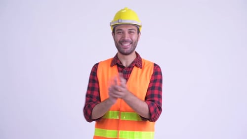 Smiling Construction Worker Clapping in Safety Gear