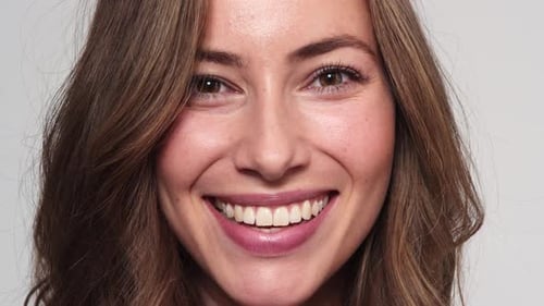 Radiant Woman Smiling Confidently in Close-Up
